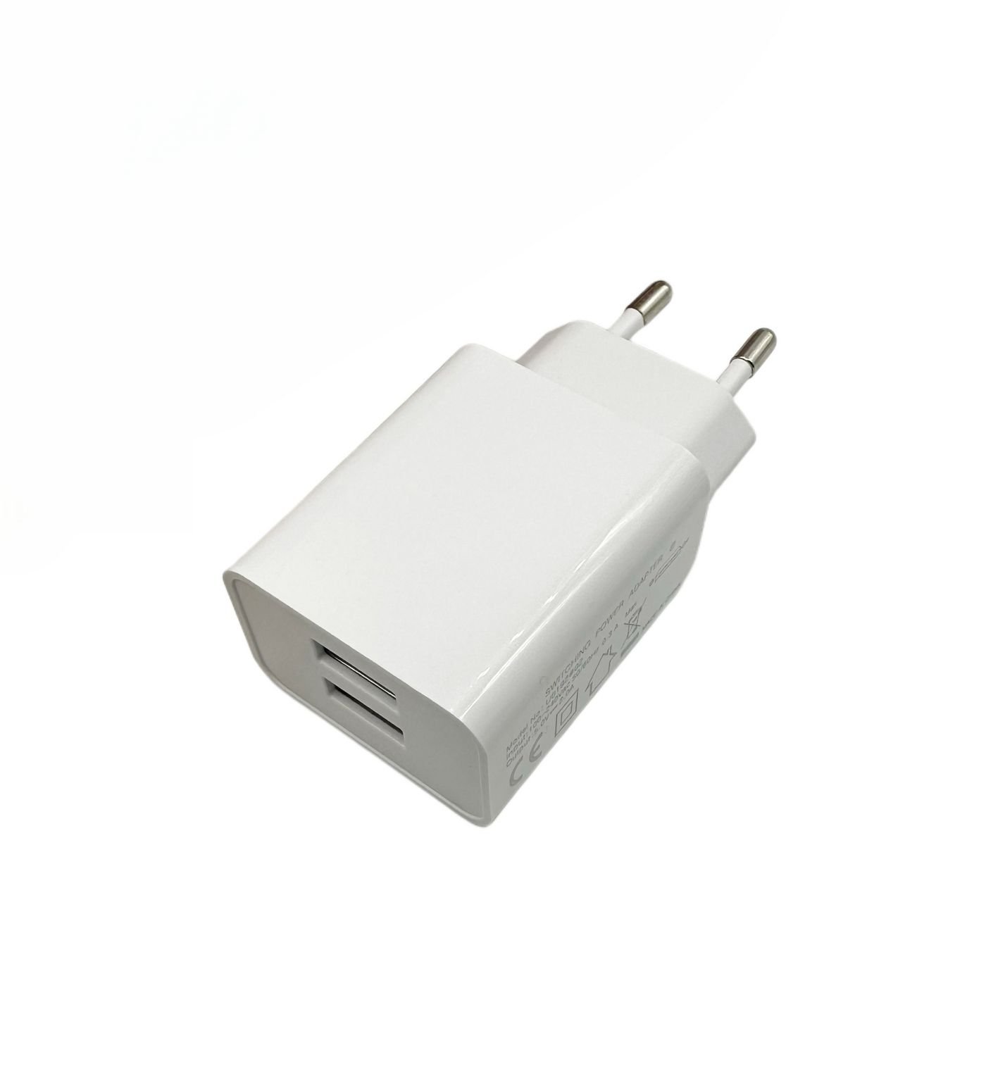 Img_35207487.jpg Charger for Smartphones 2.4Amp 2USB Port, Slim Design For smartphones or tablets. Input: 230V. Output: 5V/2.4A/12Watt - Image 1